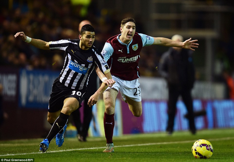 Abeid (left) goes toe to toe with Burnley defender Stephen Ward in the early stages at Turf Moor 