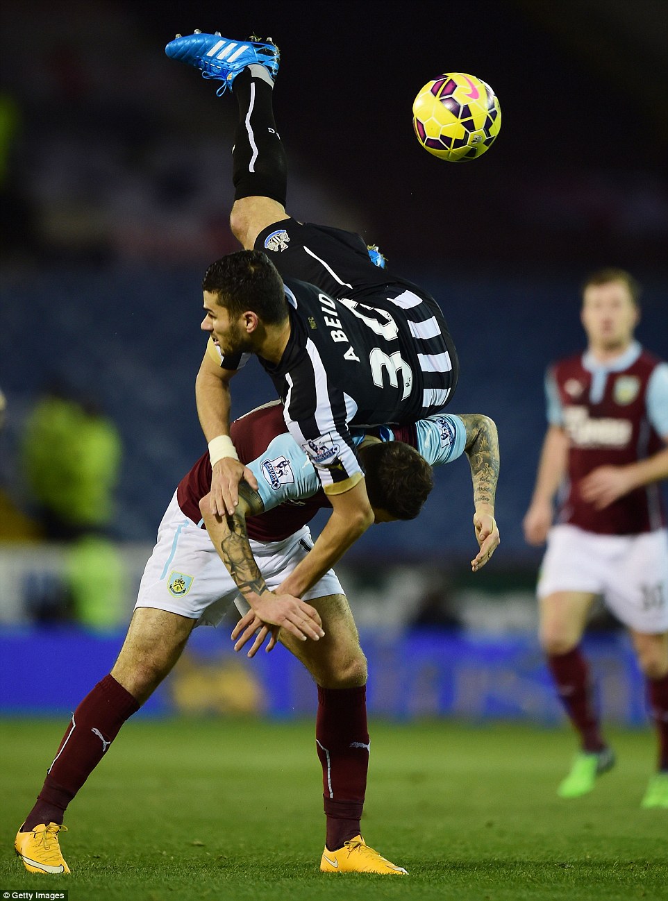 Newcastle United's Mehdi Abeid takes a spectacular tumble after contesting for the ball with Burnley's Danny Ings