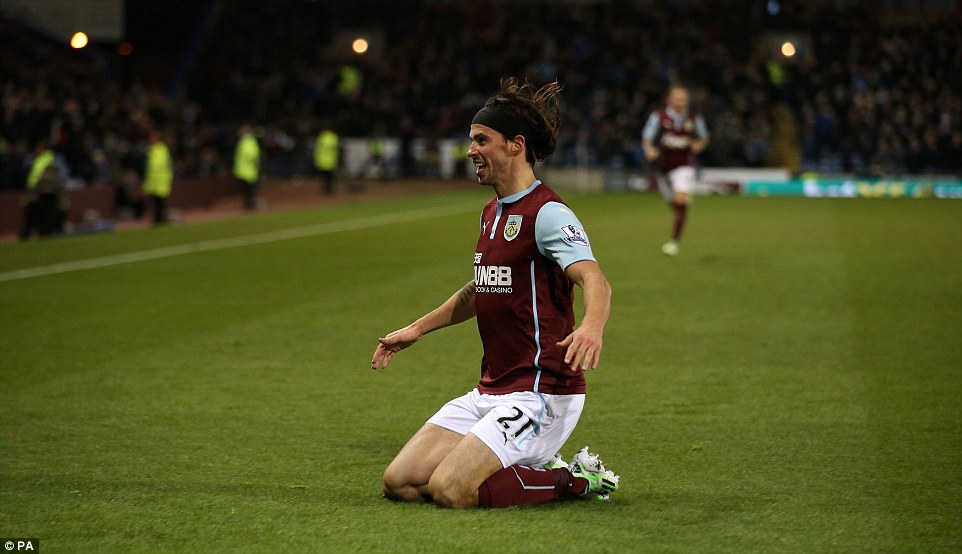 Boyd slides across the grass in front of the Turf Moor faithful after his 34th minute strike 