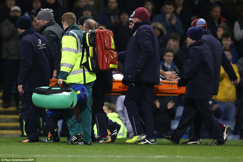 Clarets defender Ward is carried out of the pitch in a stretcher after his suffered an injury in the second half 