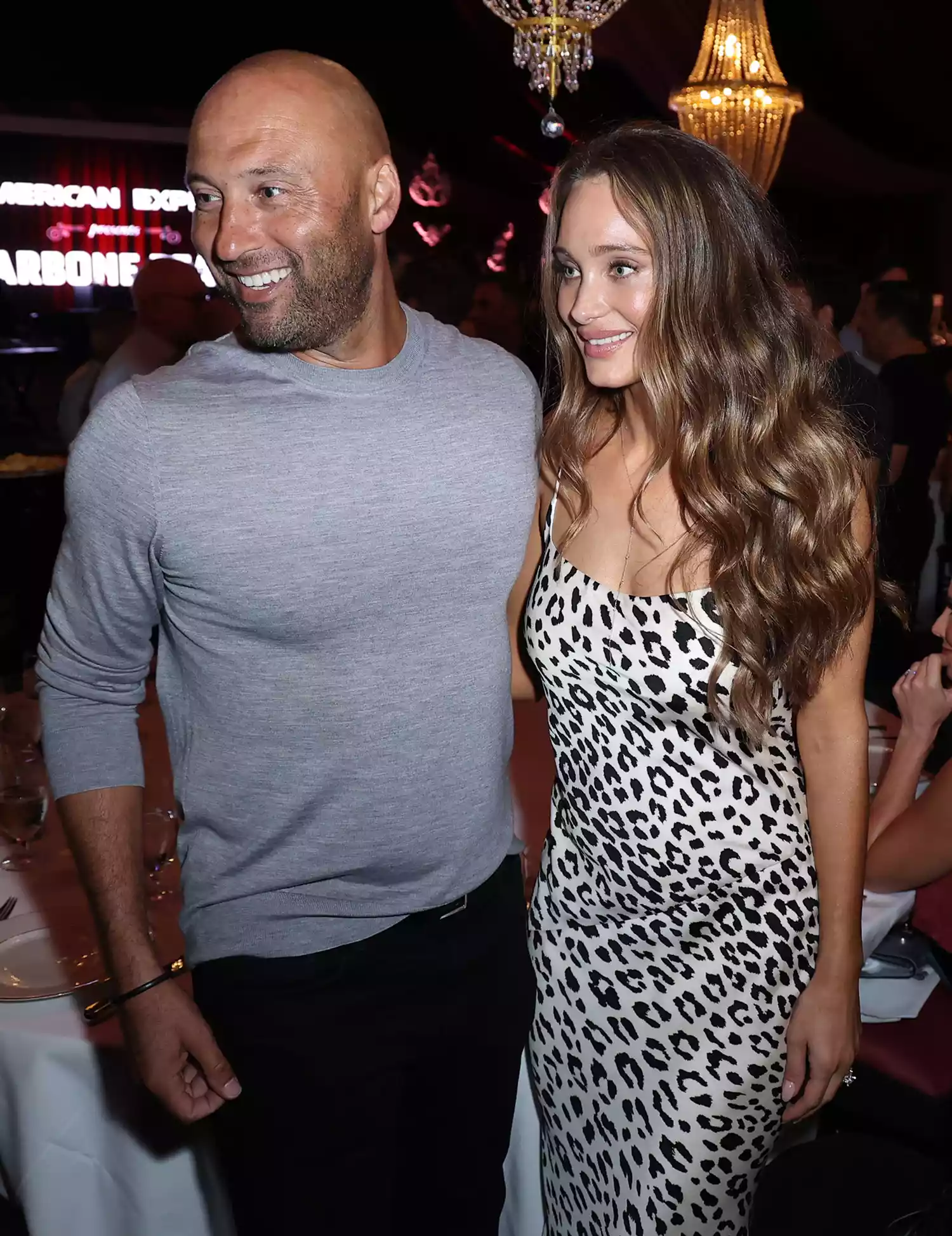 Derek Jeter and Hannah Jeter attend American Express Presents CARBONE Beach at Carbone on May 06, 2022 in Miami Beach, Florida