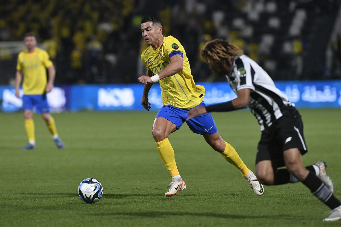 Nassr's Portuguese forward #07 Cristiano Ronaldo vies for the ball with Shabab's Saudi defender #27 Fawaz Al-Sagour during the King Cup quarter-final football match between Al-Shabab and Al-Nassr at the Al-Shabab Club Stadium in Riyadh on December 11, 2023. (Photo by AFP) (Photo by STR/AFP via Getty Images)