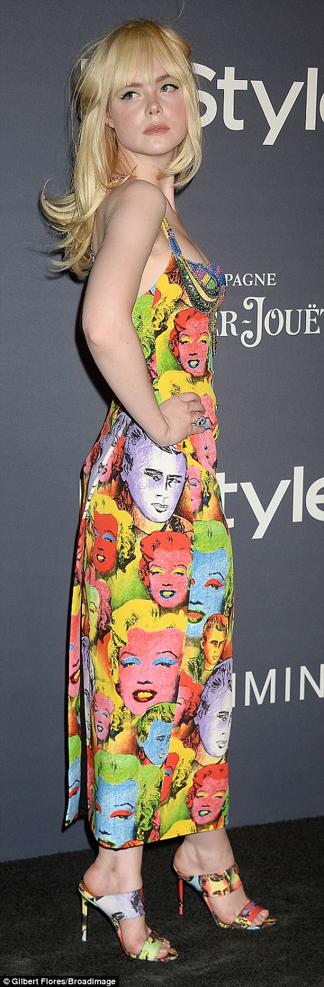 Fashionista: Elle Fanning, 19, sported a sleeveless dress dotted with Andy Warhol prints of James Dean and Marilyn Monroe that had a very low-cut sweetheart neckline and wore patterned heels that matched her backless dress