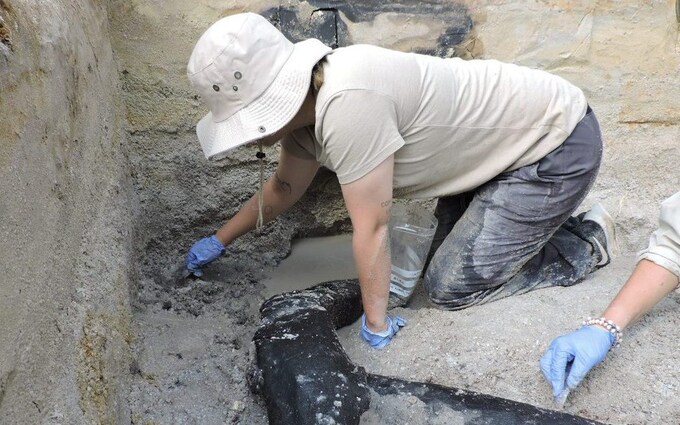 An archaeologist at the site in Zambia