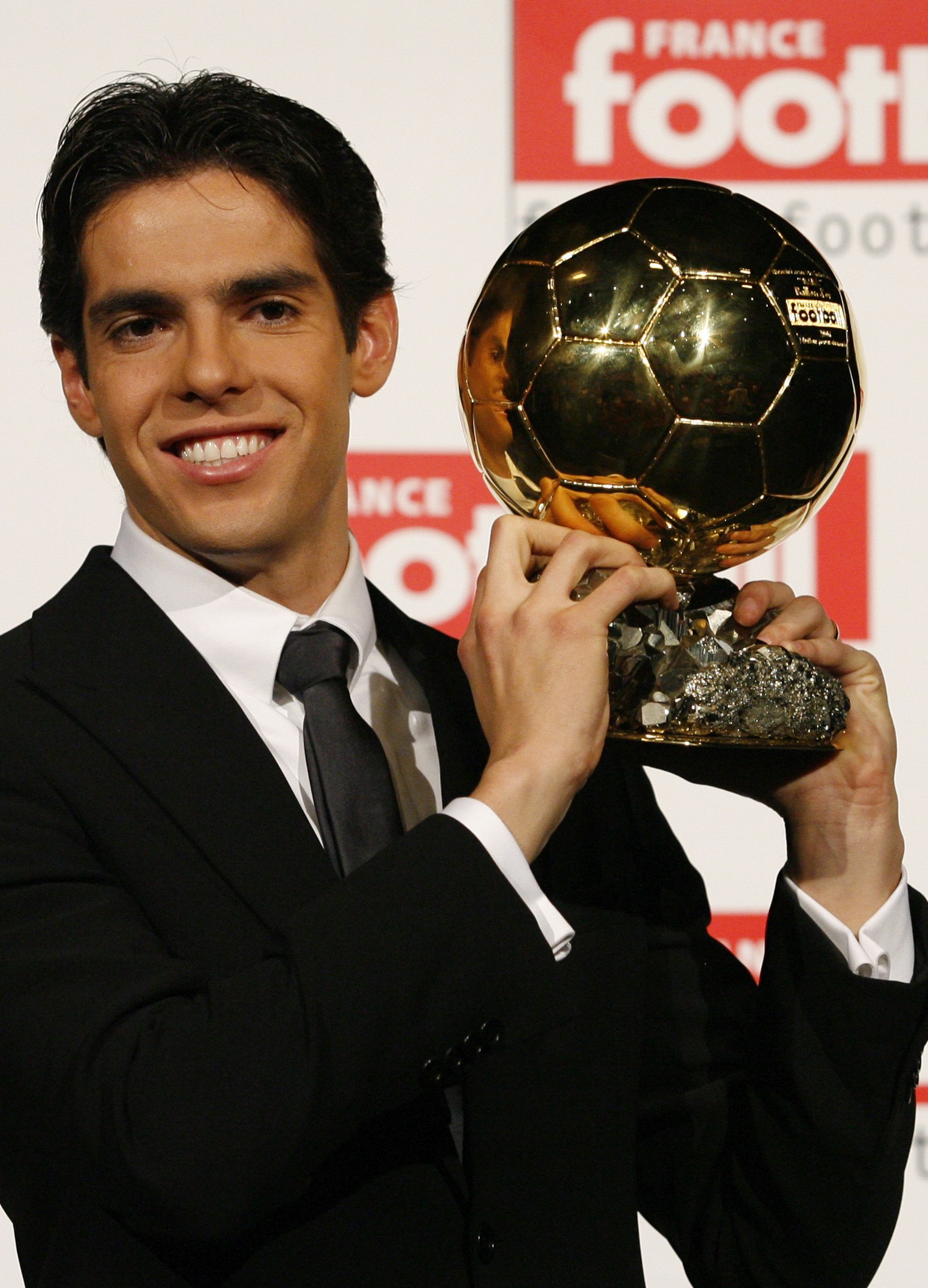 AC Milan and Brazil playmaker Kaka holds the 2007 Ballon d'Or trophy in Paris