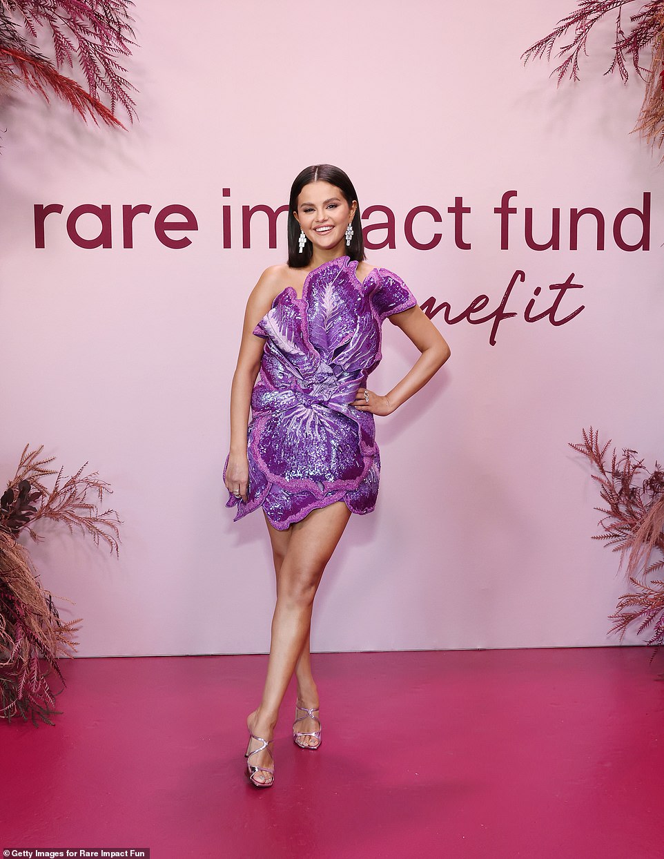 Flower power: For her second red carpet look, Gomez stunned onlookers in a fun purple minidress shaped like a hisbiscus flower