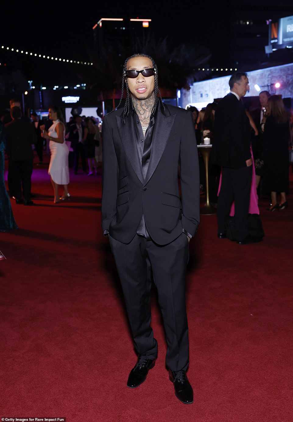 Tyga also offered a smile on the sidelines before getting in front of cameras on the red carpet