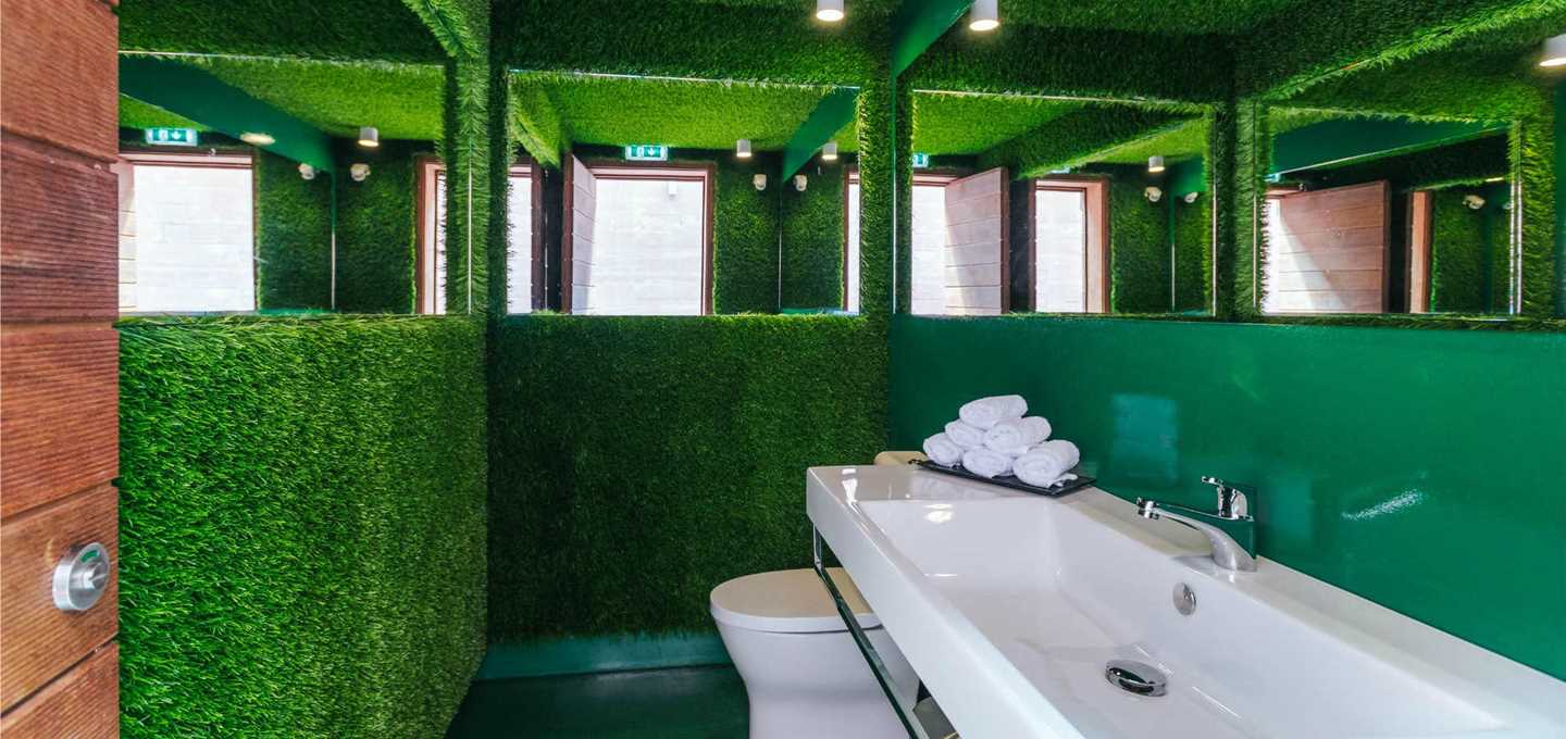 The bathrooms are football-themed at Pestana CR7 Funchal, with astro-turf lining the walls