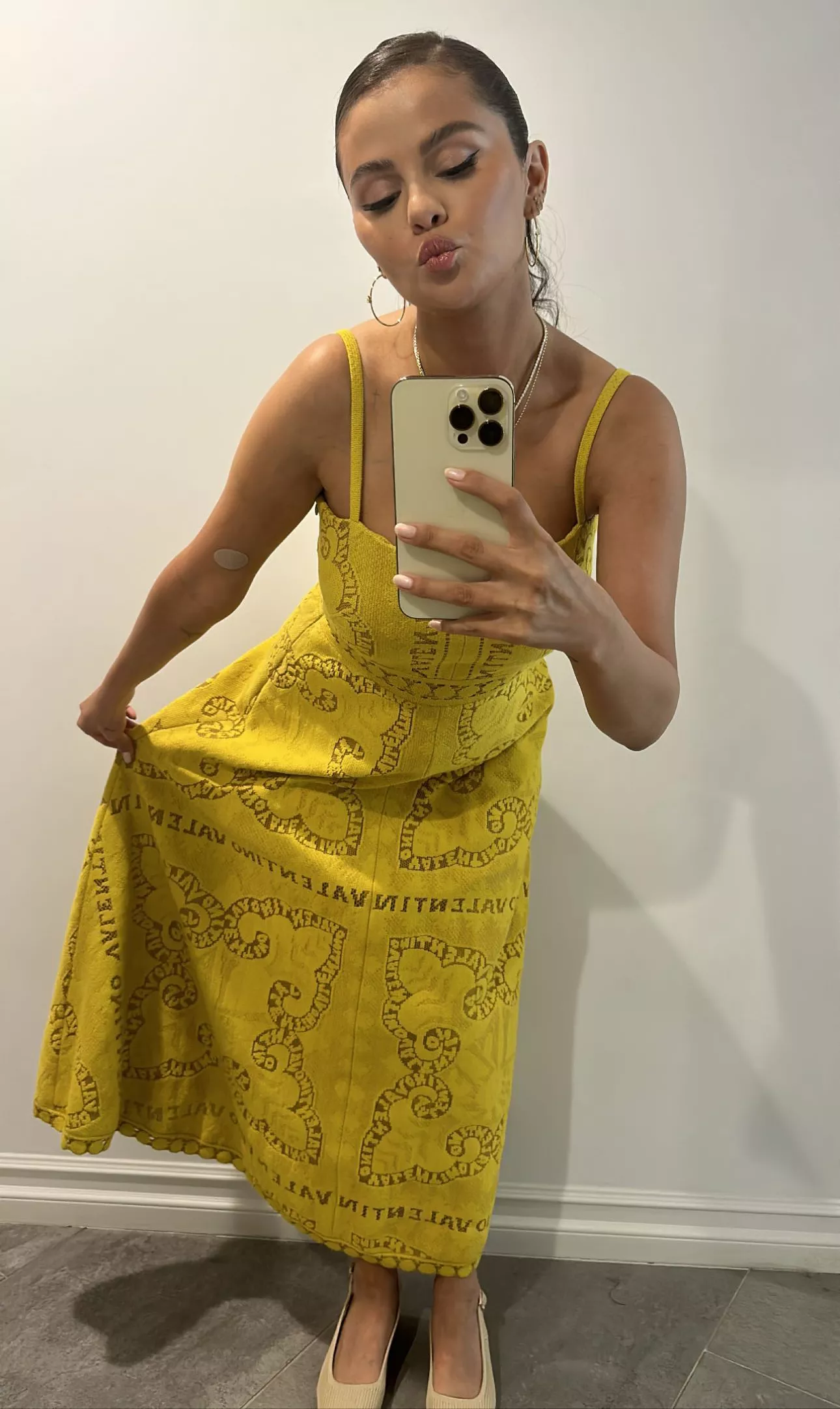 Selena Gomez Wears Chic Yellow Dress and Citrus-Style Handbag to Beauty Launch instagram 08 15 23
