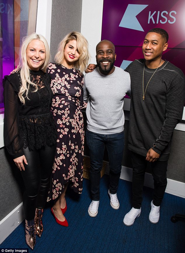Beaming: Selena appeared in high spirits as she shared a snap with Kiss Breakfast hosts Charlie, Melvin and Ricky
