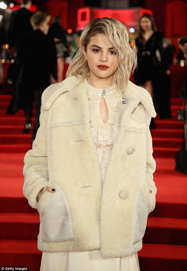 As the London temperatures drop, Selena braved the cold, throwing on a matching mid-length cream fur jacket