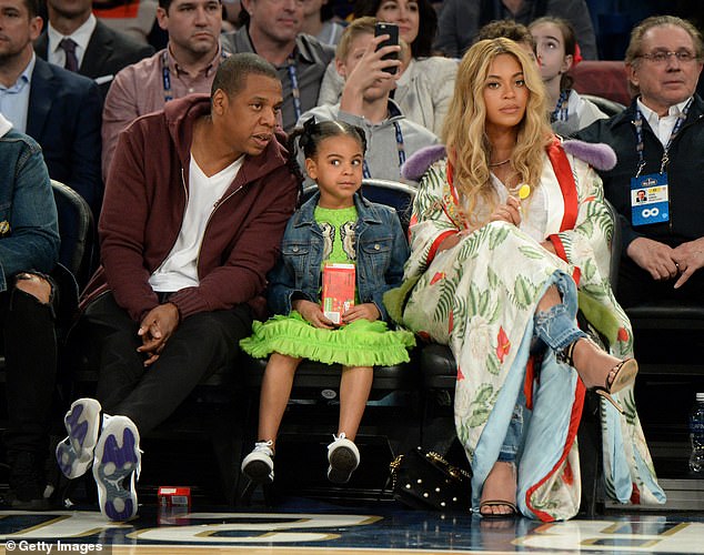 Sweet: Jay and Beyonce have often accompanied their little one to games (pictured in 2017)