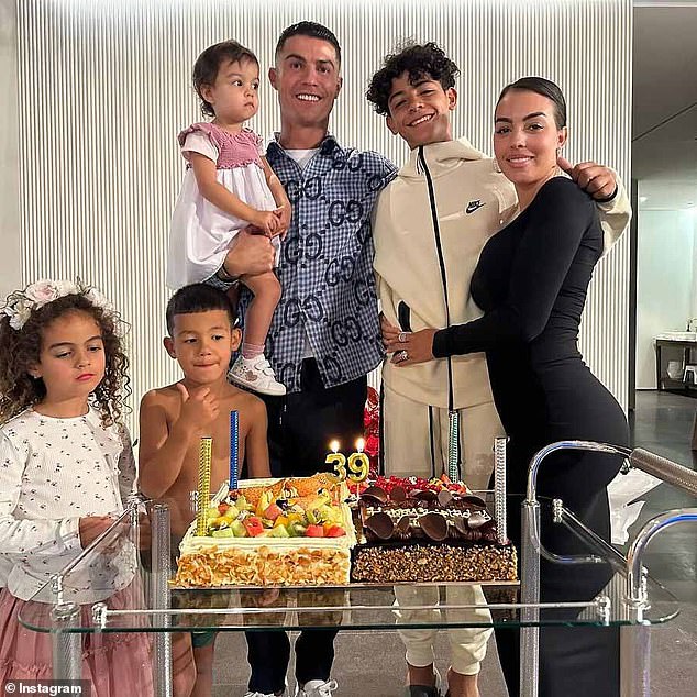 BEFORE: Georgina, who is in a relationship with Cristiano, was pictured in a family photo (pictured) to celebrate the football superstar's 39th birthday earlier this month