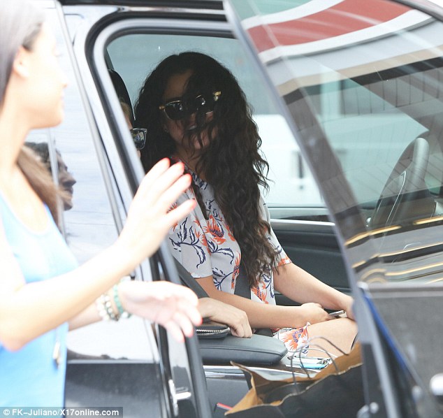 Whoops: Selena Gomez reverses into a another car has she backs out of a parking space in Los Angeles