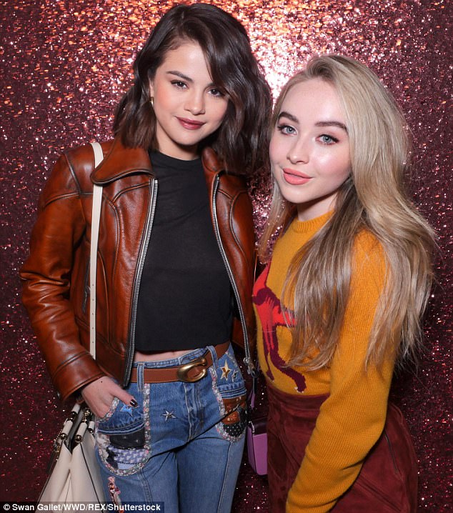 Girl power: She also posed with Smoke And Fire singer Sabrina Carpenter backstage