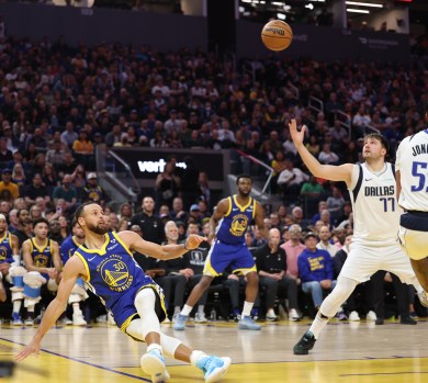 Golden State Warriors' Stephen Curry (30) ends up on the door after his shot was blocked against the Dallas Mavericks in the second quarter of a NBA game at Chase Center in San Francisco, Calif., on Tuesday, April 2, 2024. (Ray Chavez/Bay Area News Group)