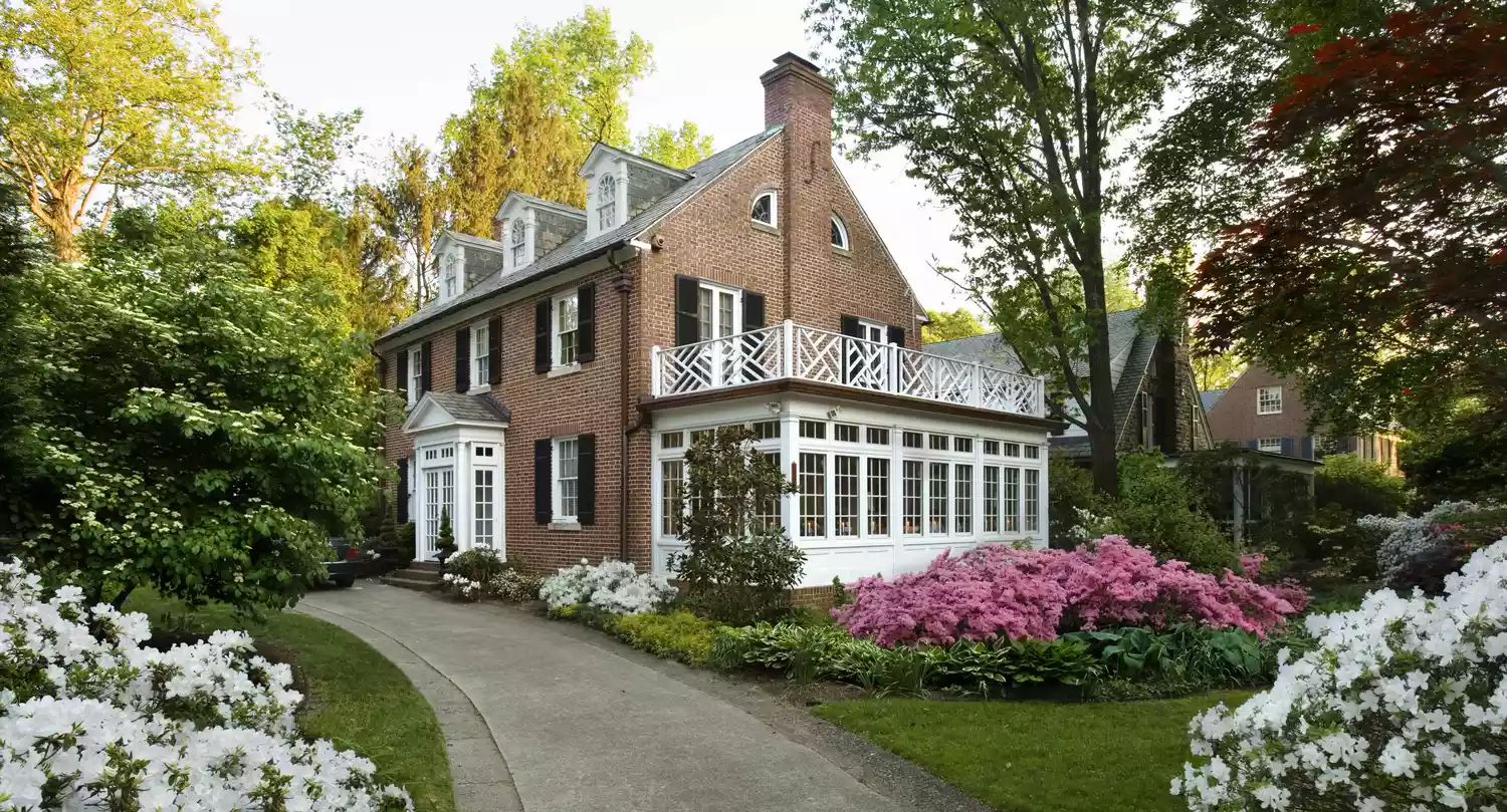 American traditional home with flower garden