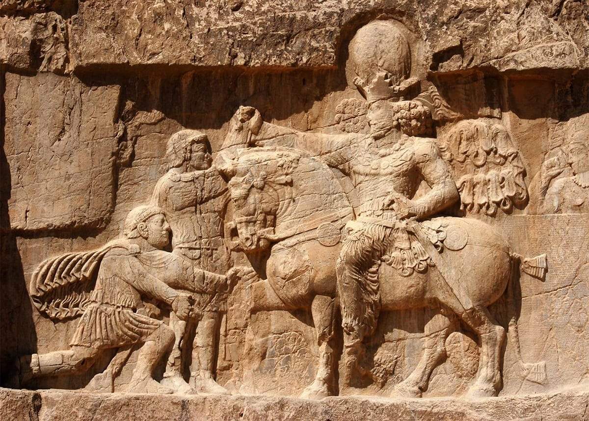 The surrender of the emperor Valerian to the Persian King Shapur I, rock relief, 260 AD, in the province of Fārs, Iran.