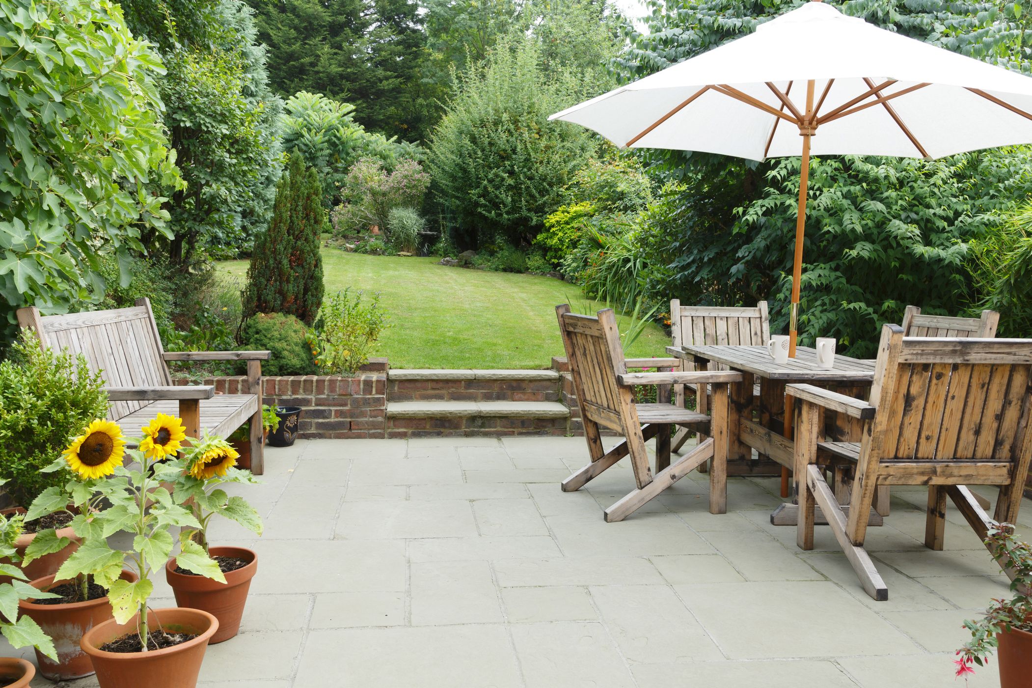 patio with garden furniture and parasol