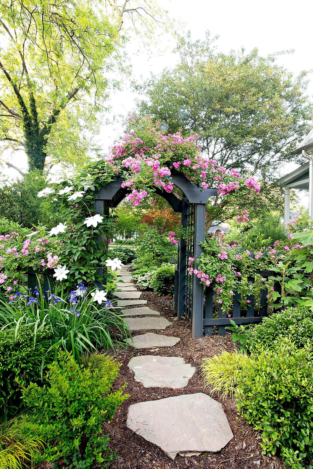 Stone walkway leading into garden