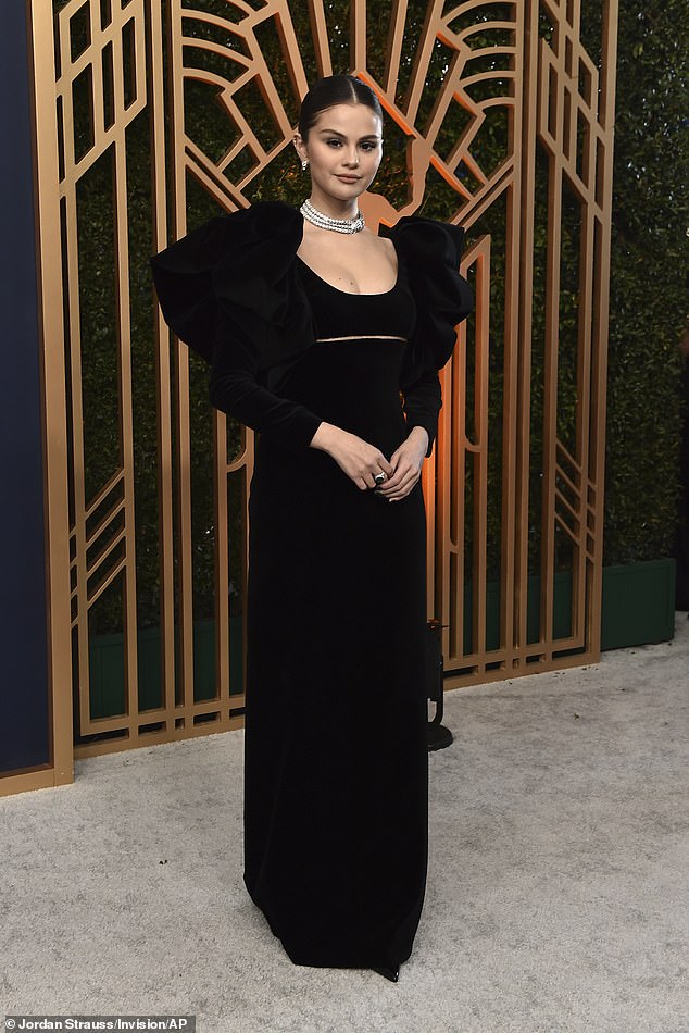 Back in black: Selena Gomez, 29, was effortlessly elegant in a black velvet Oscar de la Renta gown as she arrived at the 2022 SAG Awards on Sunday to compete for outstanding ensemble for Only Murders In The Building